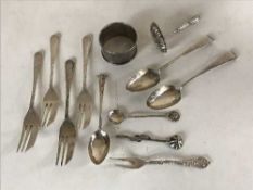 A quantity of Victorian and later silver cutlery and a napkin ring