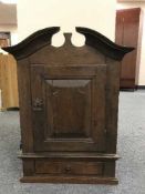 A late 19th century wall cabinet fitted a drawer