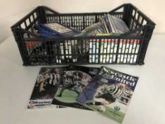 A box of cameras, NUFC football programmes,
