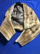 A blonde mink fur shawl.