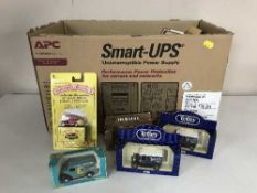 A box of boxed die cast vehicles