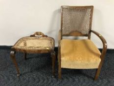 A walnut begere backed armchair and a dressing table stool
