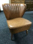 A 1960's vinyl upholstered bedroom chair.