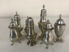 A pair of silver sifters and five others (7)