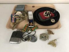 A tray of beret bearing The Association of Jewish Ex Serviceman's badge, assorted military badges,