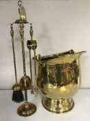 A brass coal bucket and a companion set on stand