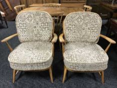 A pair of elm Ercol armchairs