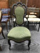 A late 19th century ebonised hall chair