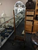 A walnut framed cheval mirror