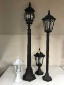 Two electric garden lights together with two garden lampposts