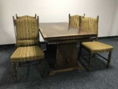 An oak refectory dining table and four chairs
