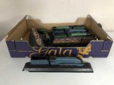 A box of six model trains and a model of the RMS Titanic