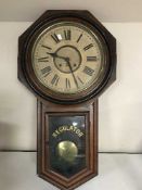 A late Victorian American Regulator clock with pendulum