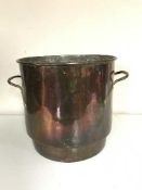 An antique copper coal bucket