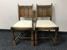 Four carved oak dining chairs