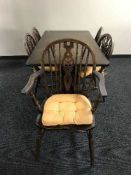An oak refectory dining table and five chairs