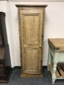 A reclaimed pine single door cupboard