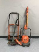 A box of sash clamps, power tools, sprit levels, sack barrow,