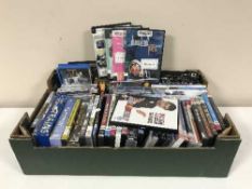 Three boxes of DVDs, football annuals,