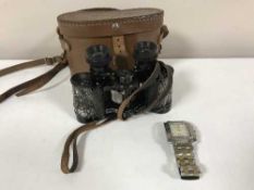 A Tissot gent's wrist watch and a pair of miliary cased binoculars in case marked Royal Artillery