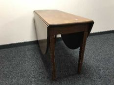 An inlaid mahogany drop leaf table