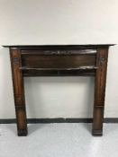 An Art Nouveau mahogany fire surround