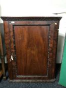 A Victorian mahogany hanging corner cabinet