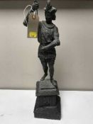 A spelter figure in 18th century dress on a marble plinth