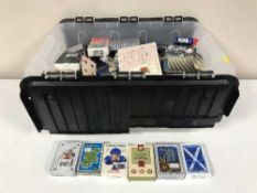 A box containing a large quantity of playing cards