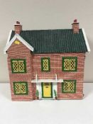 A mid 20th century doll's house containing plastic furniture