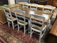 A French oak painted extending dining table and six chairs