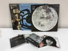 A box of LP records including Jimi Hendrix, The Beatles,