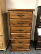 A plantation pine six drawer chest
