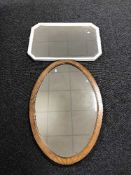 A large early 20th century oak framed mirror and a painted framed mirror