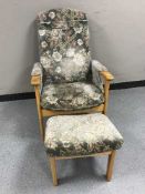 A green dralon armchair and stool