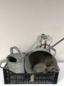 A basket of two galvanised watering cans, bucket, block and tackle,