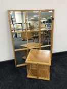 An oak revolving book stand and a pine framed section mirror