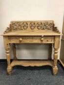A pine Victorian style side table fitted with two drawers