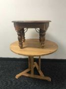 A circular pine pedestal coffee table and lamp table