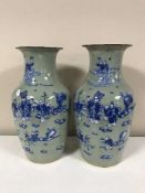 A pair of Chinese celadon glaze vases depicting figures and deer,