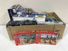 A box of plastic modelling kits - Revel, etc and boxed Airfix Paratroopers,