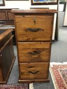 A plantation pine three drawer filing chest with key