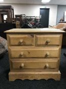 A pine four drawer chest