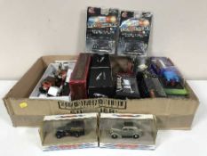 A box of boxed and unboxed die cast vehicles