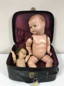 A vintage case of a German doll and one other