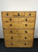 A pine nine drawer campaign style chest