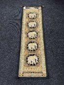 A beaded Indian wall hanging depicting elephants