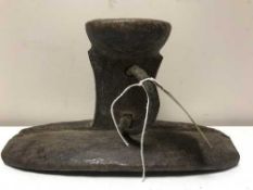 A hardwood tribal headrest