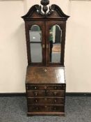A nineteenth century walnut bureau bookcase of unusually small proportions,