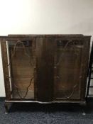 A walnut double door display cabinet